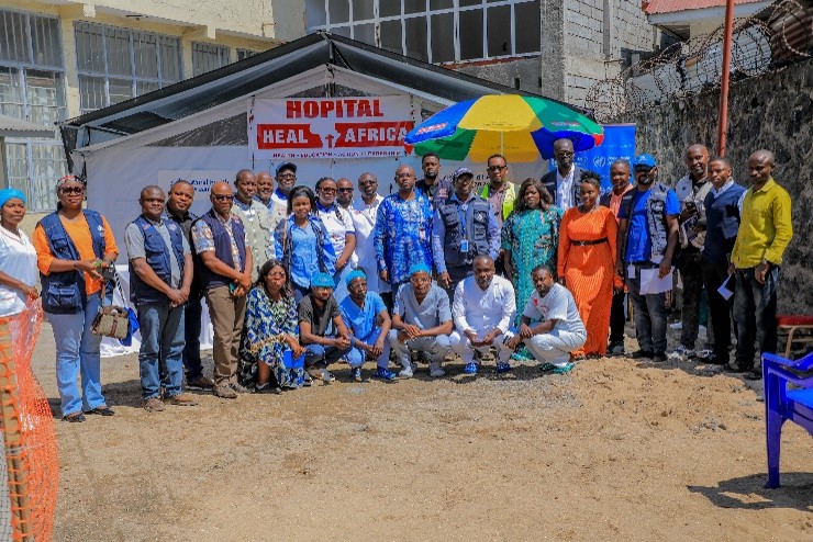 HEAL Africa team stood in front of the hospital