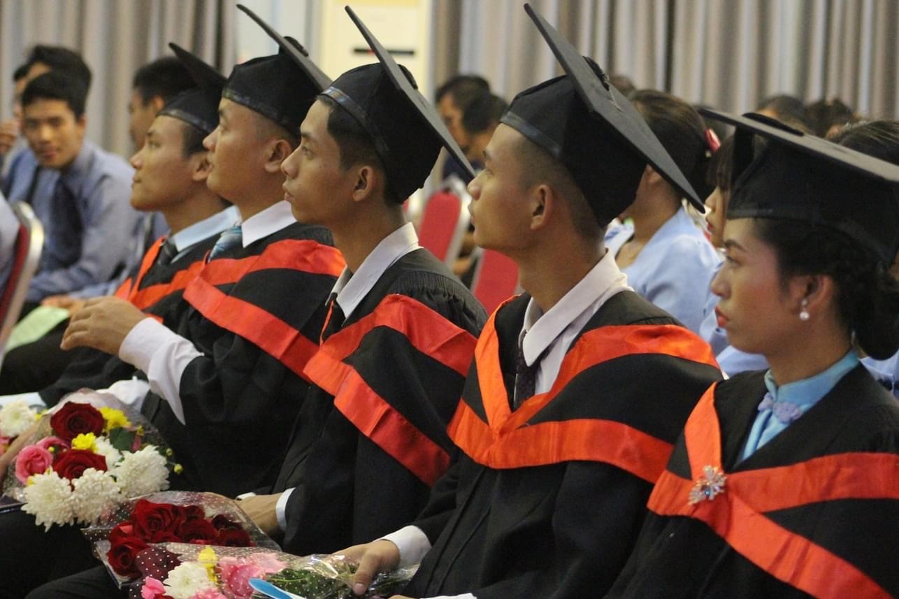 a line of young adults at a graduation ceremony 