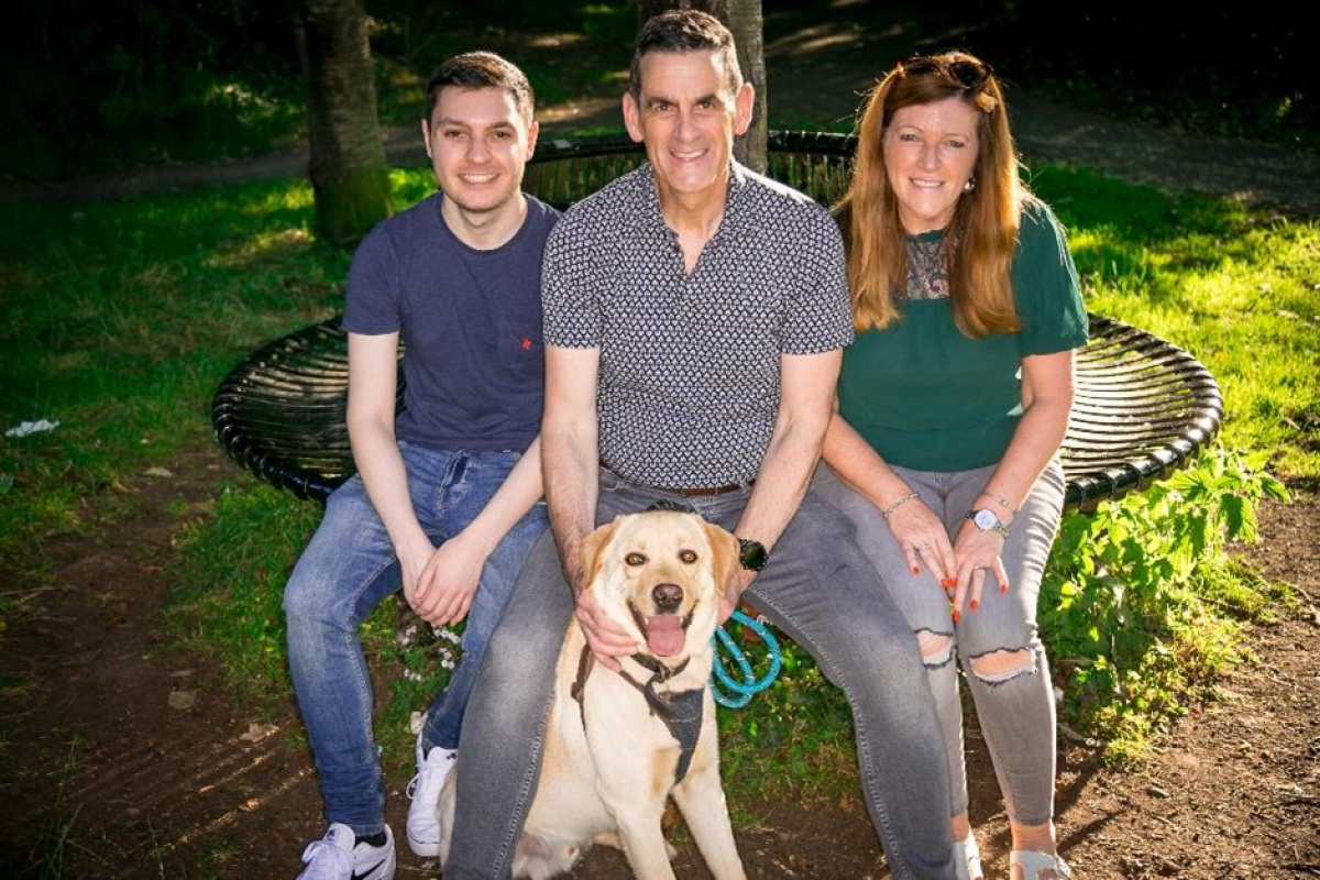 Andrew and his family, including their labrador Jazz