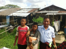 Myanmar family receiving nets