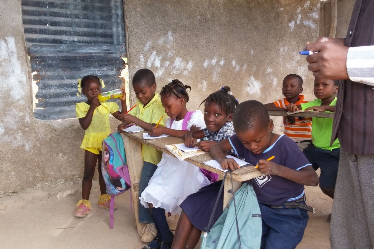 PiFo Haiti school children at wooden desks