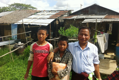 Myanmar family receiving nets