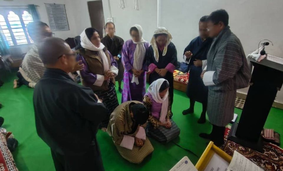 a line of young adults at a graduation ceremony 