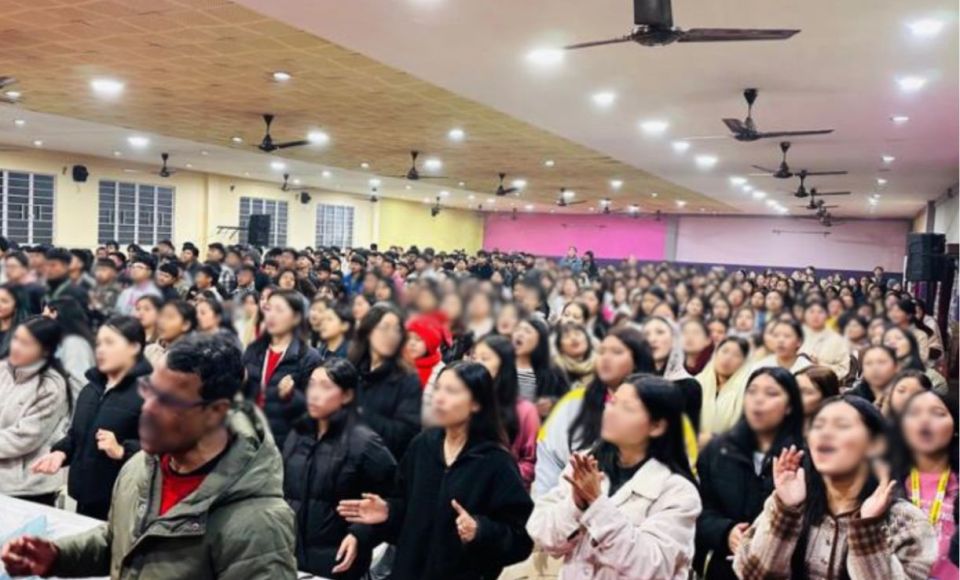 A group of people having their photo taken at church 